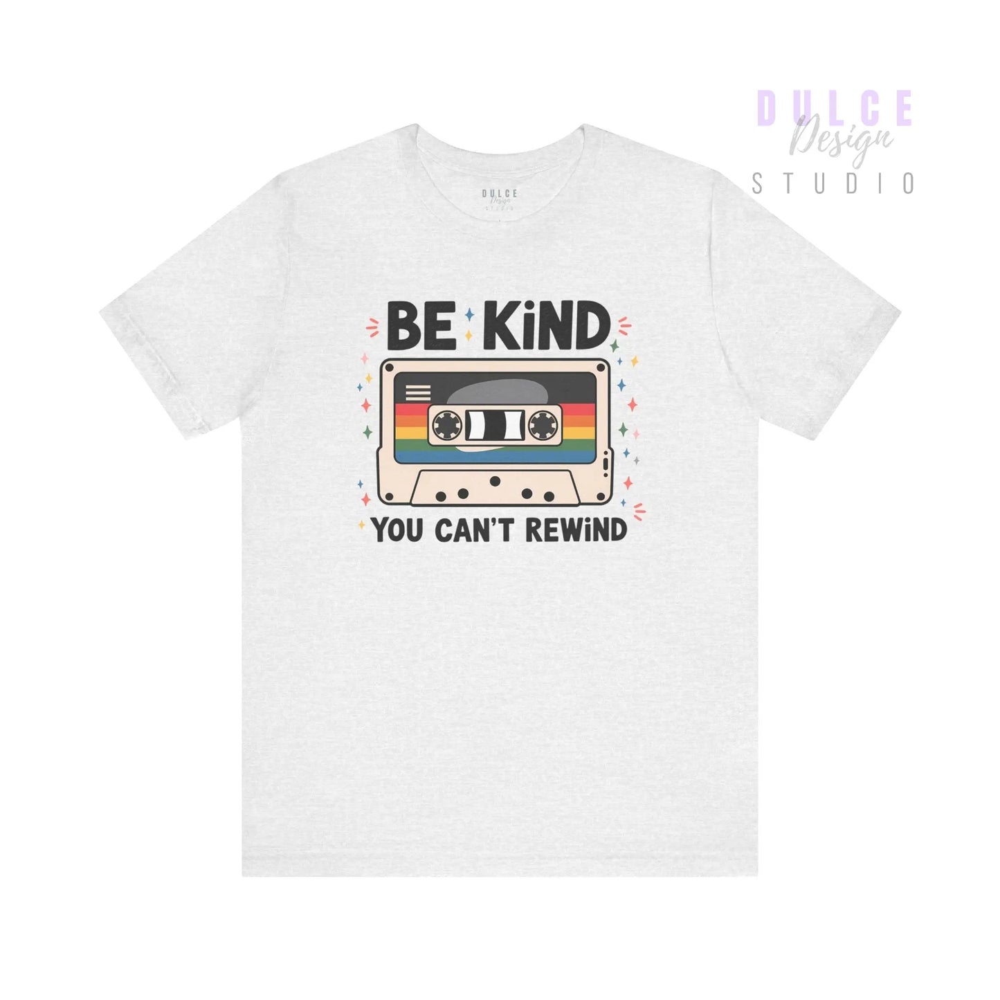 White t-shirt with a cassette tape graphic and 'Be Kind You Can't Rewind' text on a white background