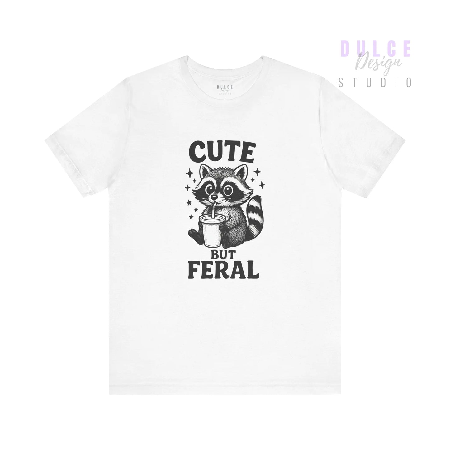 White t-shirt with a raccoon graphic and text 'Cute But Feral' on a white background