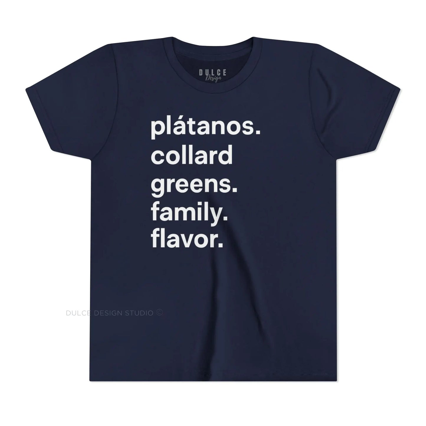 A child wearing a black crew neck t-shirt with the text 'plátanos. collard greens. family. flavor.' printed in white.