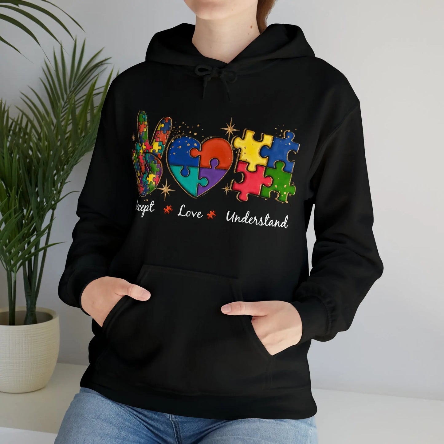 Black hoodie with colorful peace sign, heart, and puzzle piece graphic and the words “Accept, Love, Understand” – neurodiversity awareness design.