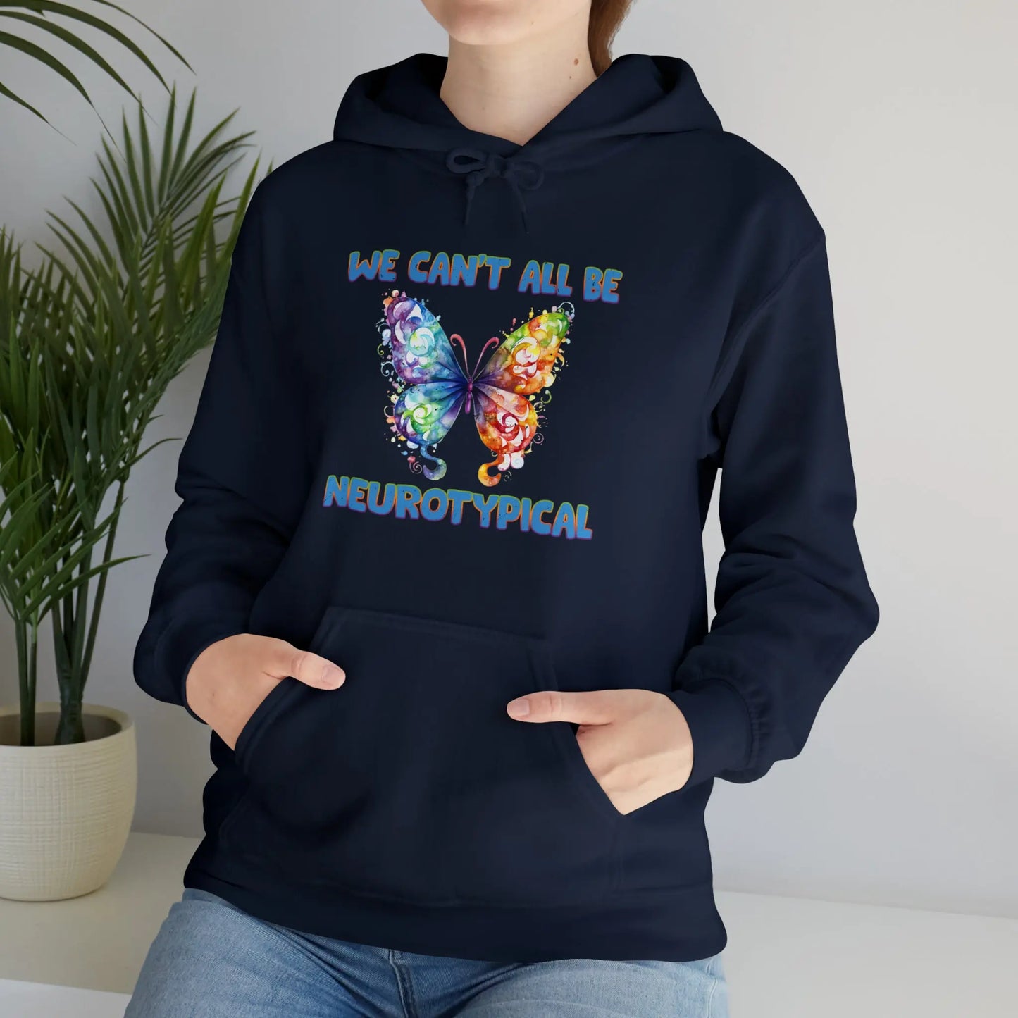 Rainbow butterfly hoodie with “We Can’t All Be Neurotypical” text for neurodiversity pride"