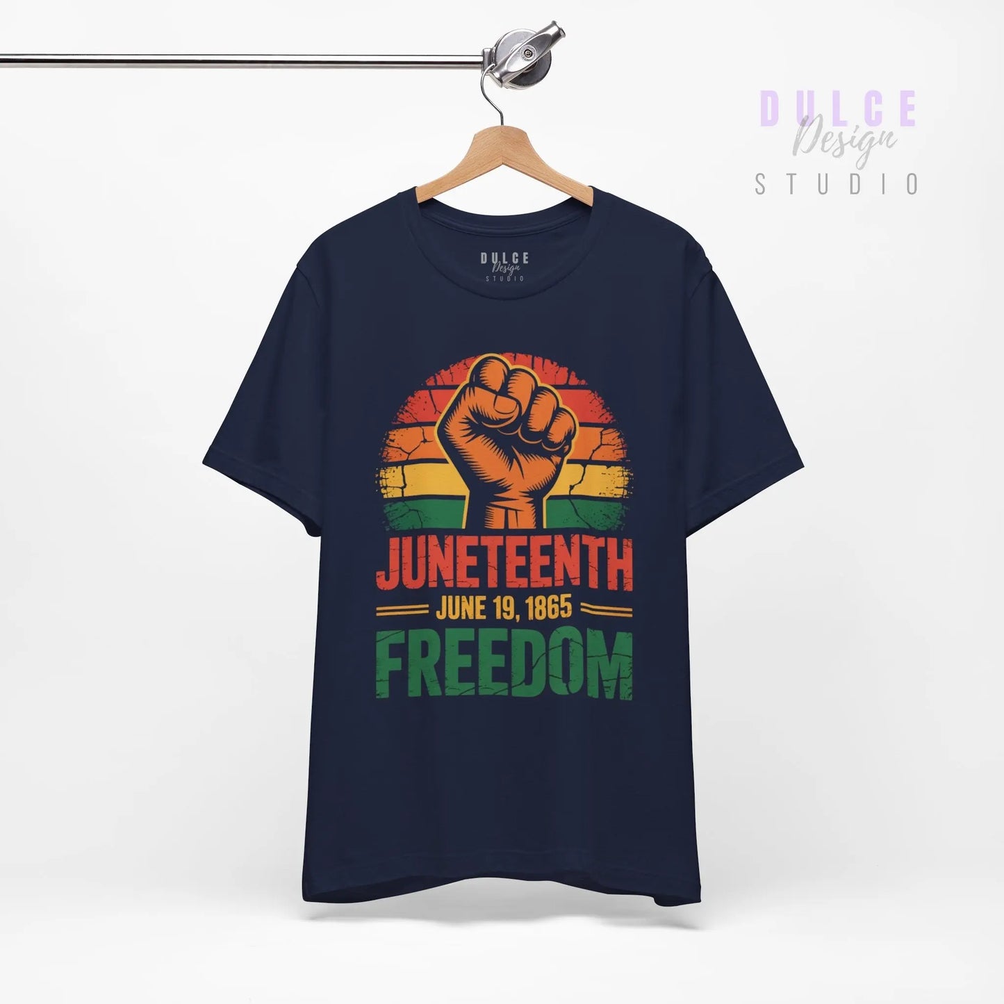 Navy blue t-shirt with Juneteenth design featuring a raised fist on a hanger against a white background.