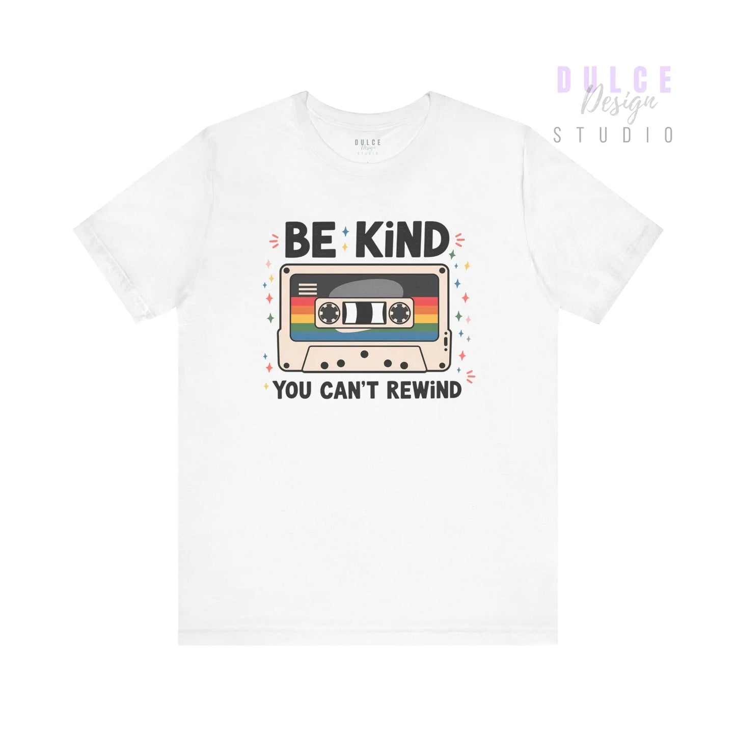 White t-shirt with a cassette tape graphic and text 'Be Kind You Can't Rewind' on a white background
