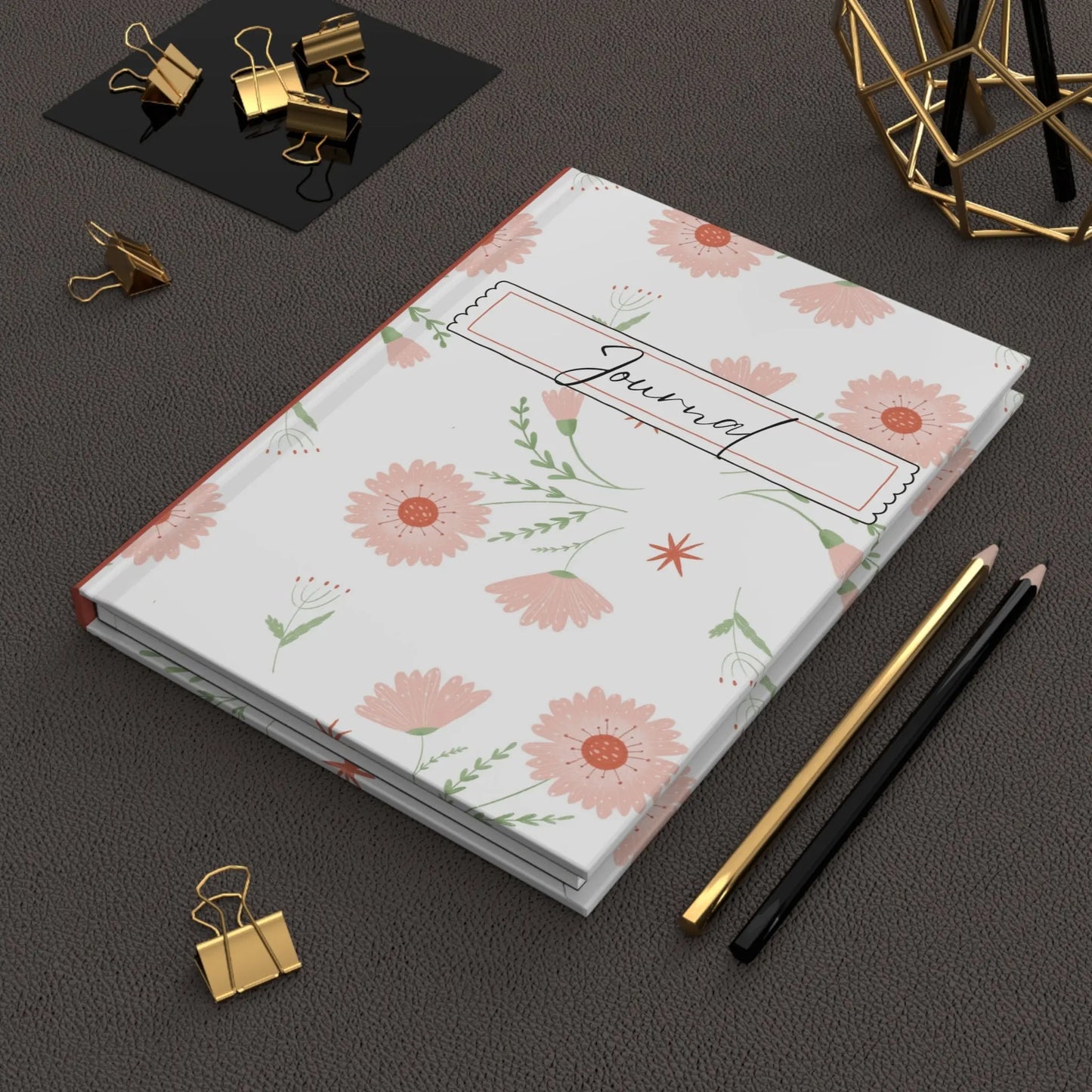 Hardcover floral journal with pink daisy pattern and lined pages