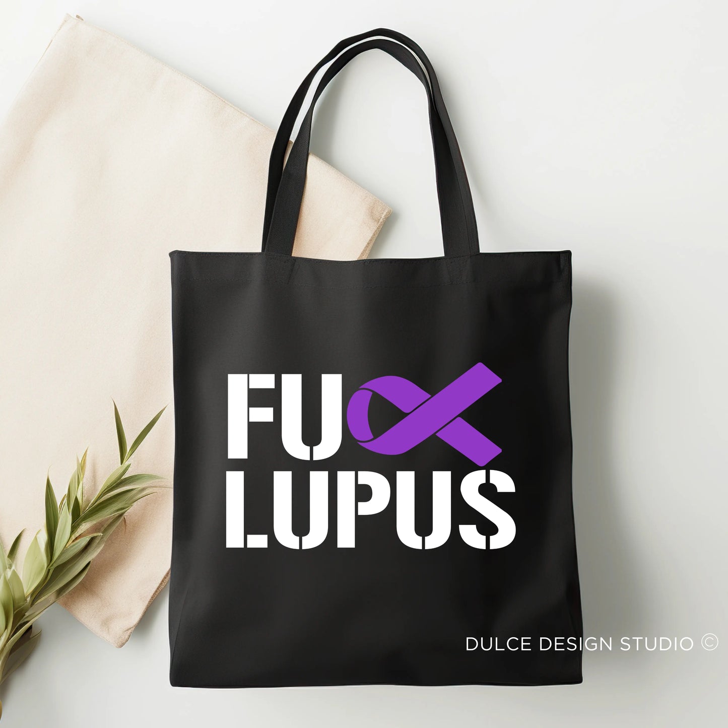 Black tote bag with “F* Lupus” text and purple ribbon awareness symbol