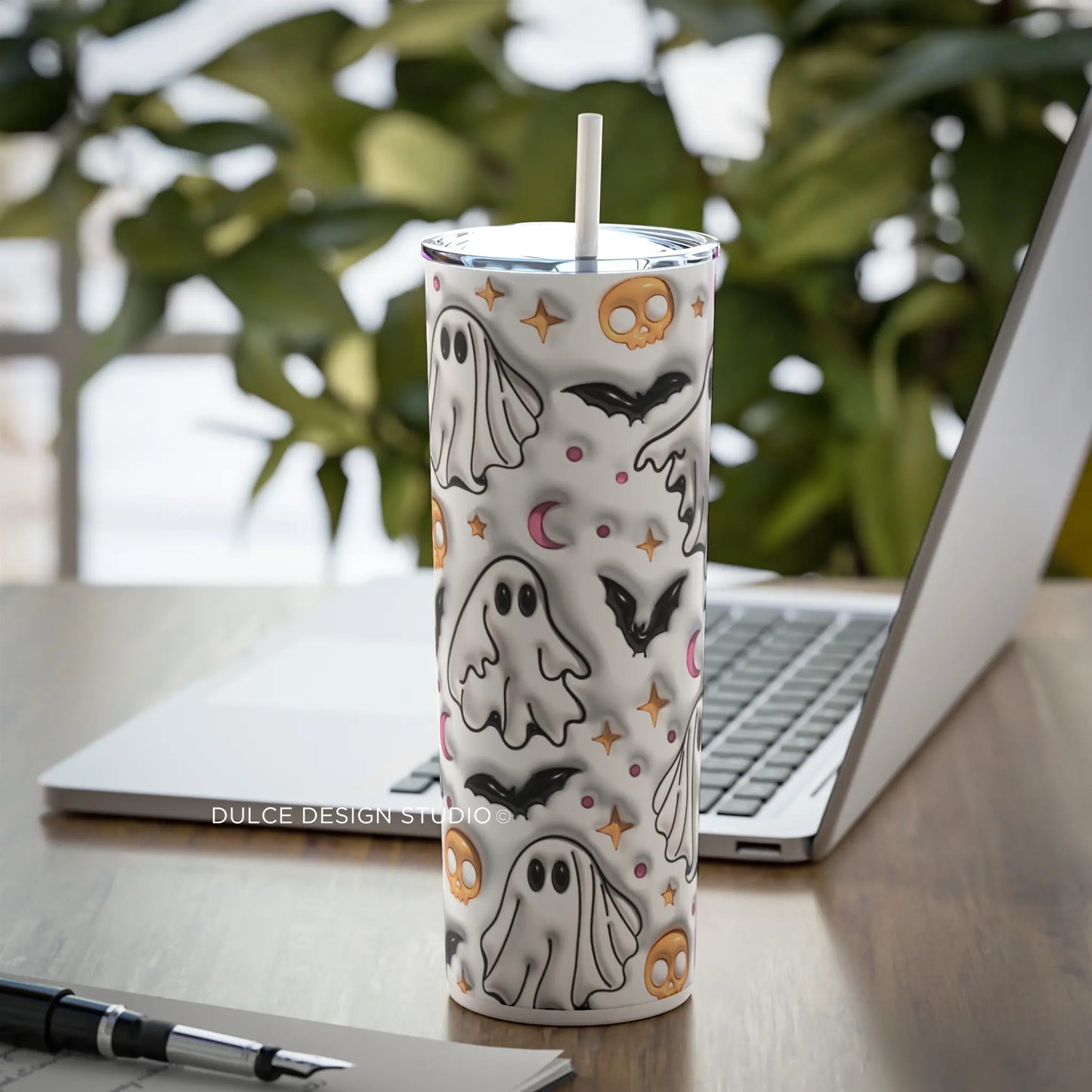 A tumbler with a 3D Halloween ghost design, featuring ghosts, bats, skulls, and moons.