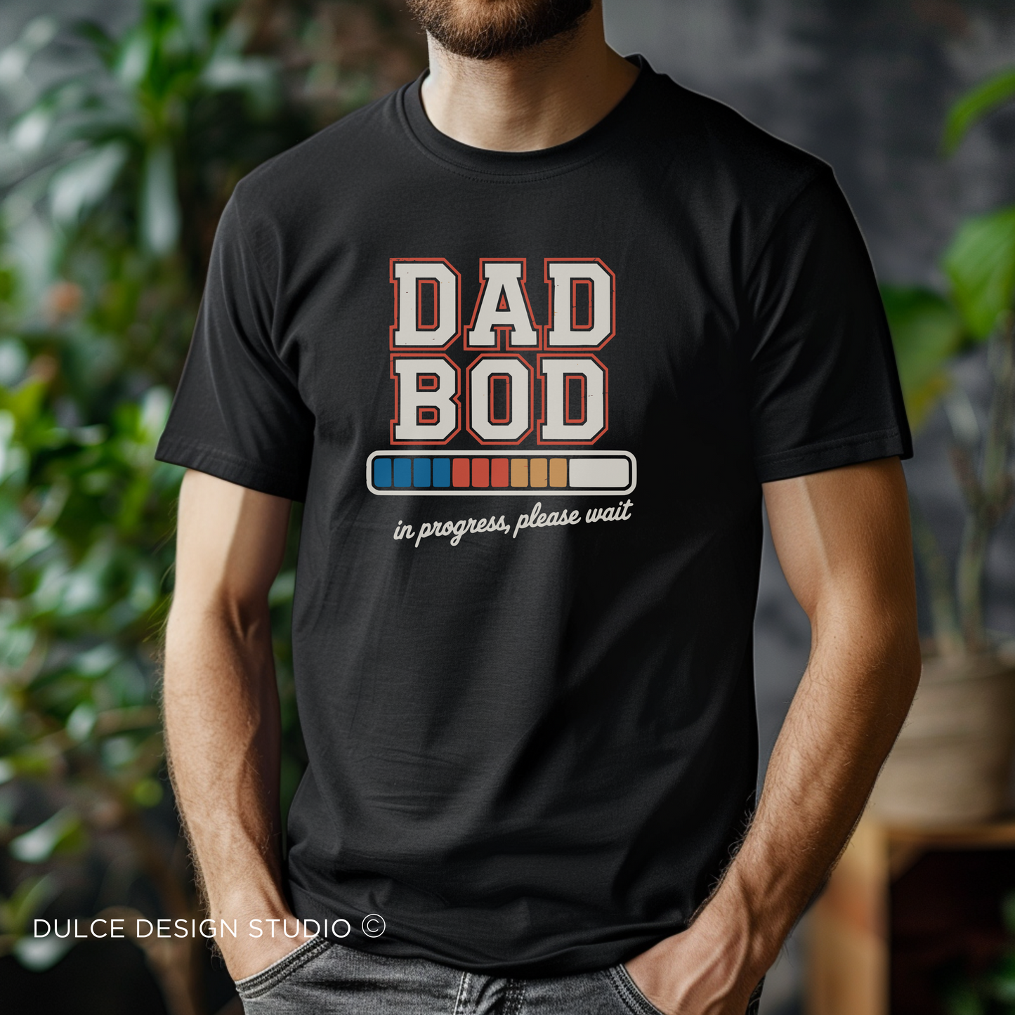 Black t-shirt with “Dad Bod in Progress” design and colorful progress bar graphic