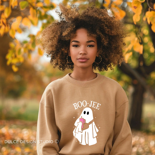 Person wearing a black hoodie with colorful puzzle pieces forming the words "Accept, Love, Understand