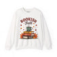White sweatshirt with 'Bookish Fall' design featuring books, a cup, and autumn leaves on a white background.