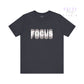 Black t-shirt with 'FOCUS' printed in white on a white background