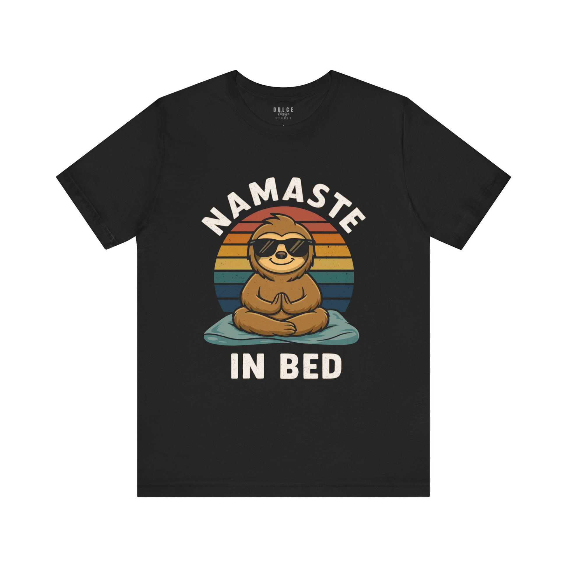 Black t-shirt with a sloth graphic and 'Namaste in Bed' text on a white background