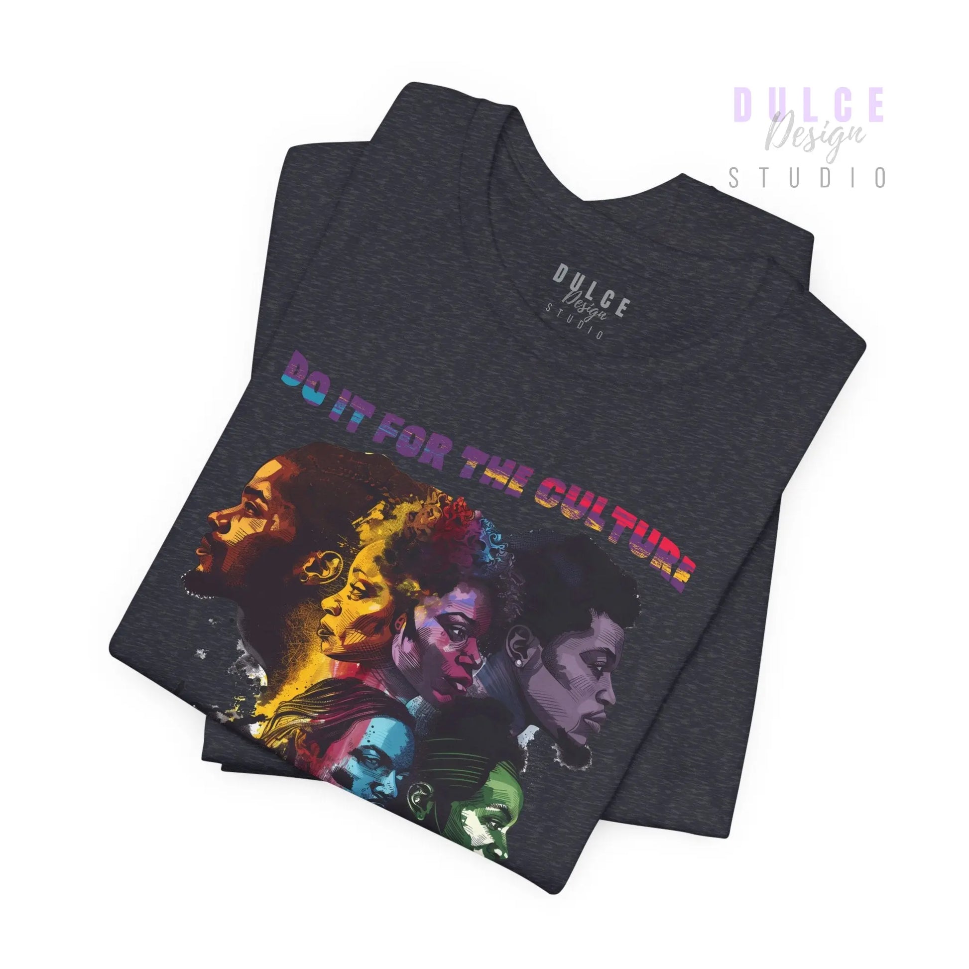 Stack of t-shirts with a colorful design and text on a white background