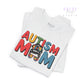 White t-shirt with 'Autism Mom' text and colorful design on a white background