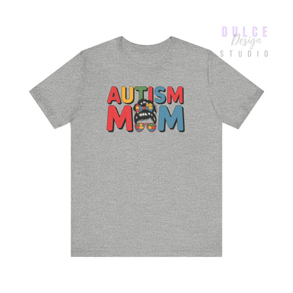 Gray t-shirt with 'Autism Mom' text and colorful design on a white background