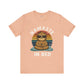 Peach t-shirt with a sloth graphic and 'Namaste in Bed' text on a white background