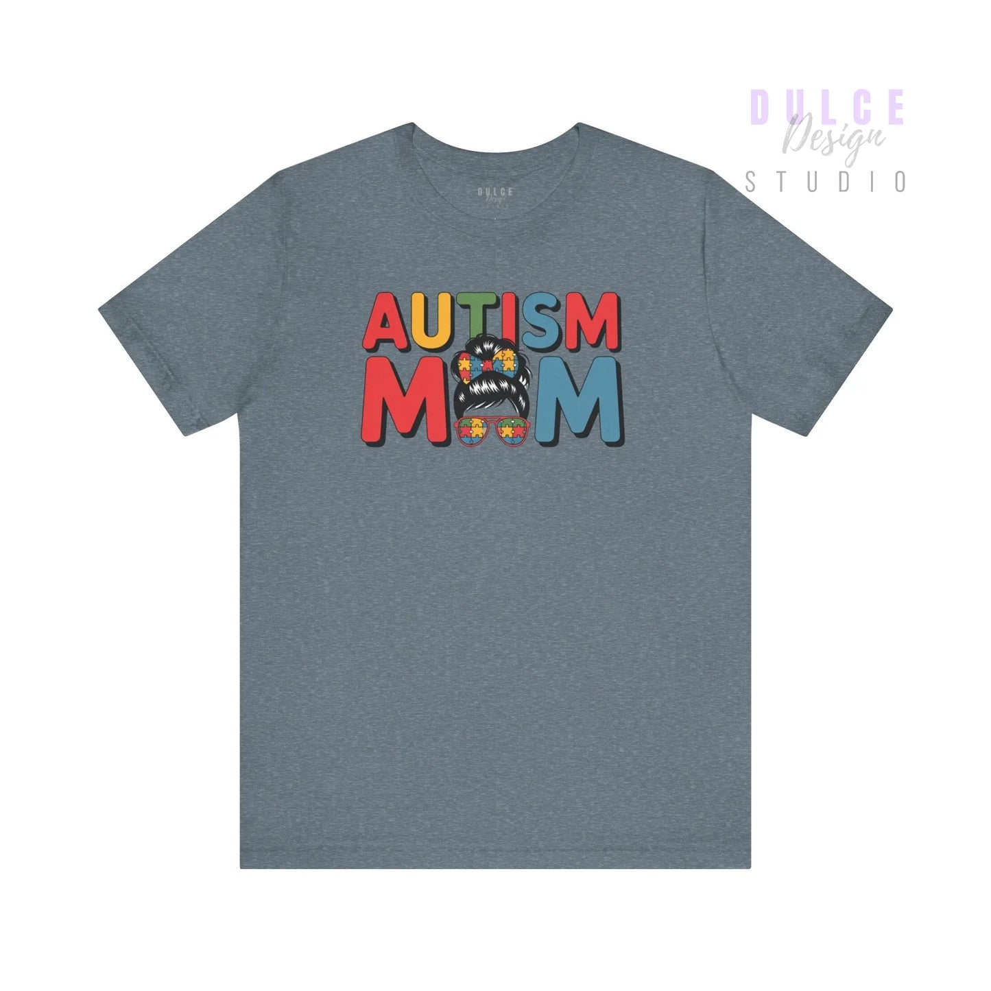 Gray t-shirt with 'AUTISM MOM' text in colorful letters on a white background
