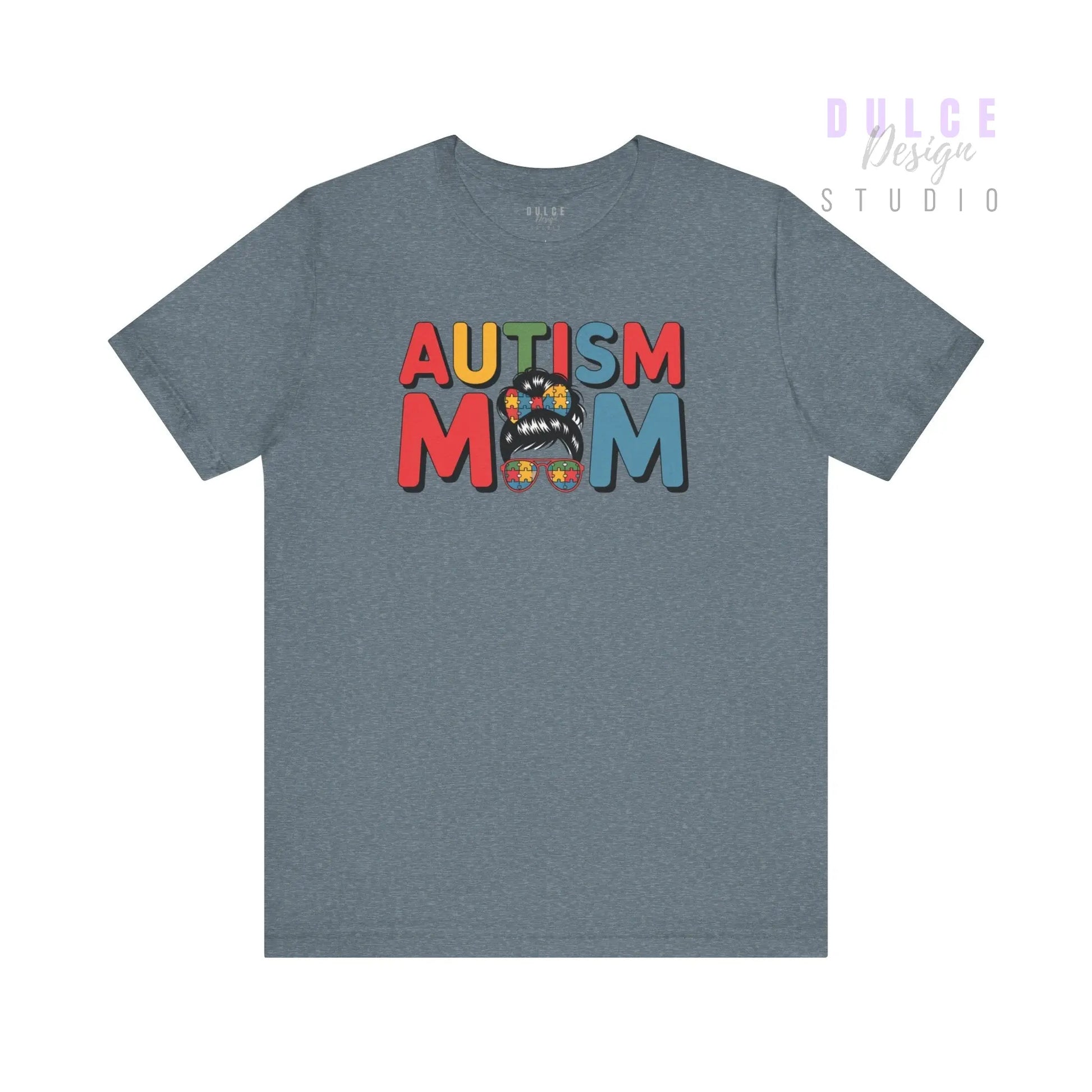 Gray t-shirt with 'AUTISM MOM' text in colorful letters on a white background
