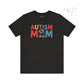 Black t-shirt with 'Autism Mom' text in colorful letters on a white background
