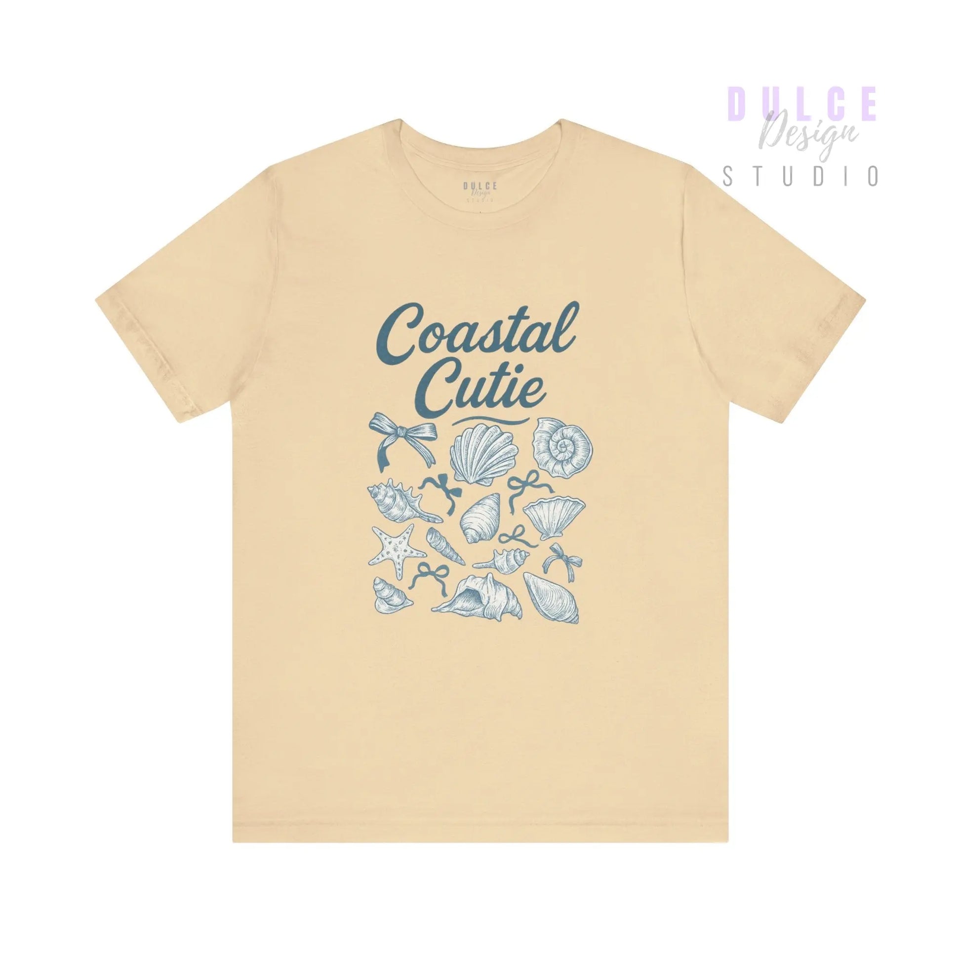 Coastal Cutie Graphic Tee – Beachy Shell & Bow Design -  Soft Cream / 3XL Dulce Design Studio