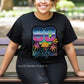 Woman wearing a Retro Vibes 80s Baby T-Shirt with sunset and palm tree graphic