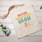 Canvas tote bag with “Helping Little Minds Grow” and floral design
