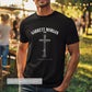 Man wearing a black t-shirt with 'Garrett Morgan' design in an outdoor setting