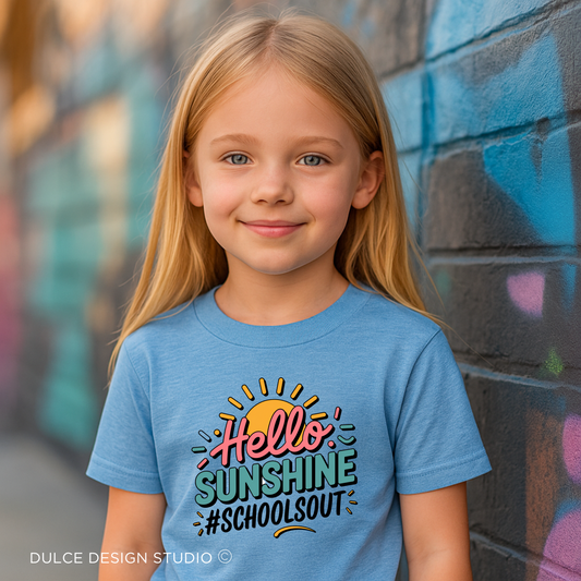 little girl wearing blue Youth  t-shirt with bright retro text ‘Hello Sunshine #SchoolsOut’ and sunburst graphic in teal, pink, and gold