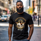 Man wearing a black ‘Disappointments All of You’ T-shirt with a saint-like figure and a glowing aura
