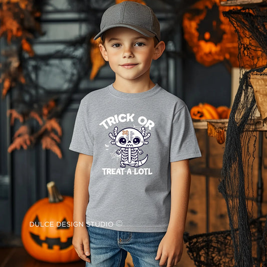 Young boy wearing a Trick or Treat A-Lotl Youth Unisex Halloween Tee with a cute axolotl skeleton design, ideal for Halloween celebrations.