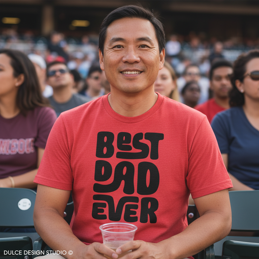 Man wearing a red 'Best Dad Ever' shirt at a sports event