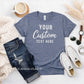Blue t-shirt with 'Your Custom Text Here' text, jeans, sneakers, and a cup of coffee on a white surface.