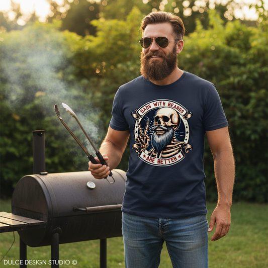 Man wearing a navy blue t-shirt with a graphic design, standing outdoors near a barbecue grill.