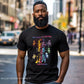 Man wearing a black t-shirt with colorful  Do it for the culuture, Juneteenth graphic design on a city street
