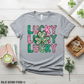 Flat lay of athletic heather Bella Canvas tee with Lucky shamrock design