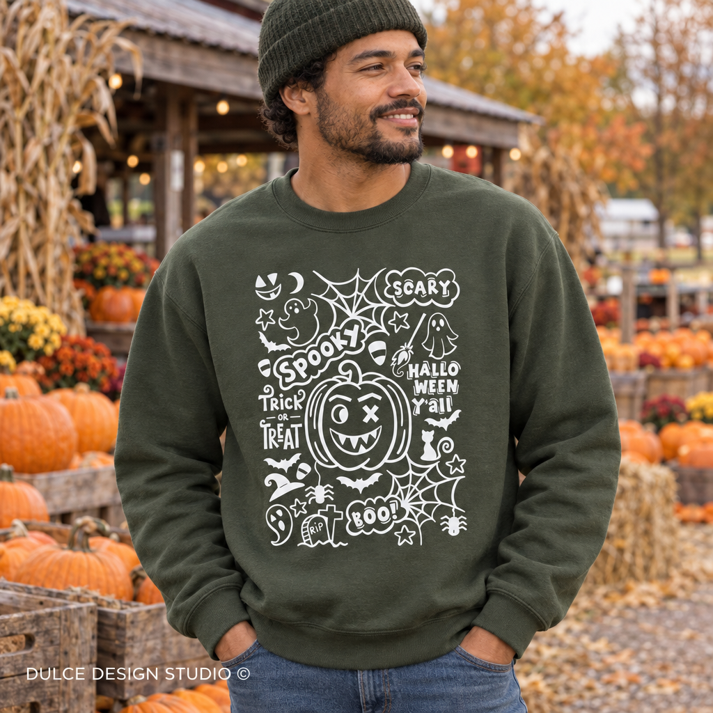 Man at an autumn pumpkin market wearing a military green Halloween typography crewneck sweatshirt.