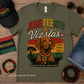 Green t-shirt with Juneteenth and Vizslas design on a wooden surface with accessories.