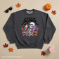 Just Waiting for Halloween drink skeleton crewneck flat lay