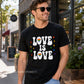 Man wearing a black t-shirt with 'LOVE IS LOVE' text and rainbow flag, standing on a street.