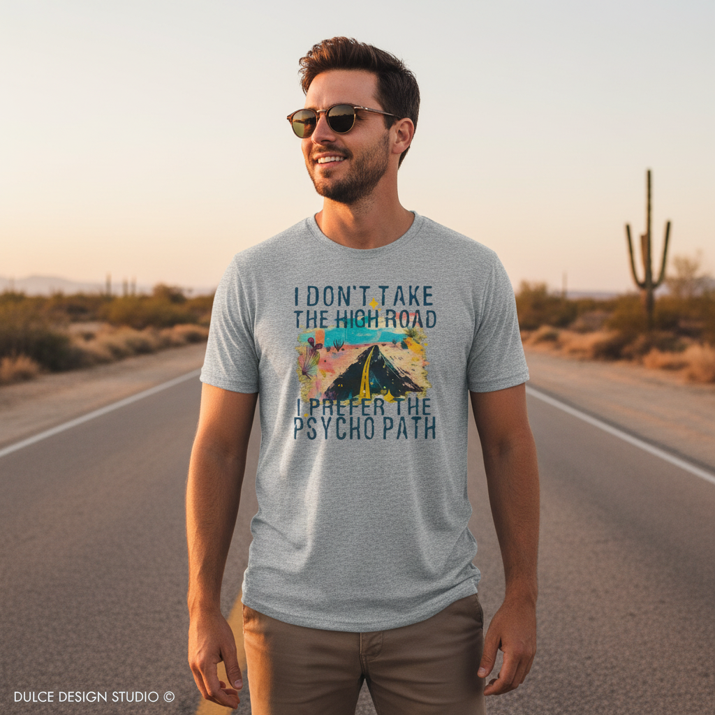 Man wearing a t-shirt with a graphic design and text in a desert setting