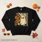 Retro floral ghost black crewneck flat lay