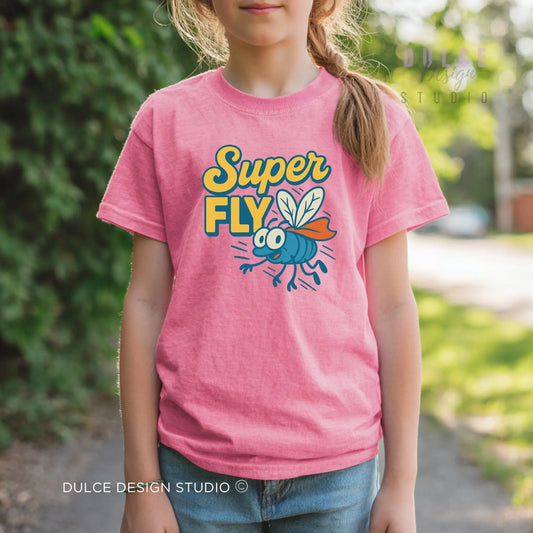 Child wearing a pink t-shirt with 'Super Fly' design outdoors