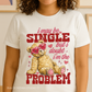Bella+Canvas 3001 tee featuring teddy bear in heart sunglasses with “I may be single but I doubt I’m the problem” quote