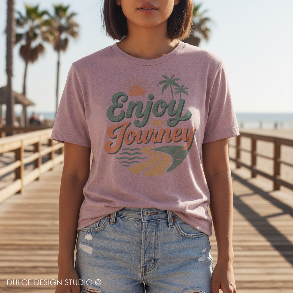 Person wearing a pink t-shirt with 'Enjoy Journey' design on a wooden boardwalk.