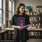 Woman wearing oversized black Comfort Colors t-shirt with Genius Club design