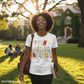 Person wearing a 'Young Gifted & Black' t-shirt on a college campus